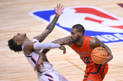 Feb 19, 2022; Cleveland, OH, USA; Howard Bison guard Elijah Hawkins (3) is pushed by Morgan State Bears guard Seventh Woods (23) during the NBA HBCU Classic at Wolstein Center. Mandatory Credit: David Richard-USA TODAY Sports