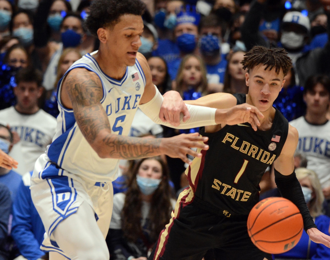 Feb 19, 2022; Durham, North Carolina, USA; Duke Blue Devils forward Paolo Banchero (5) and Florida State Seminoles guard Jalen Warley (1) fight for a loose ball during the first half at Cameron Indoor Stadium. Mandatory Credit: Rob Kinnan-USA TODAY Sports