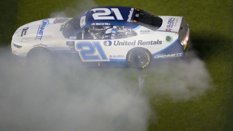 Feb 19, 2022; Daytona, FL, USA; Xfinity Series driver Austin Hill (21) celebrates winning the Xfinity Beef It's What's For Dinner 300 at Daytona International Speedway. Mandatory Credit: John David Mercer-USA TODAY Sports