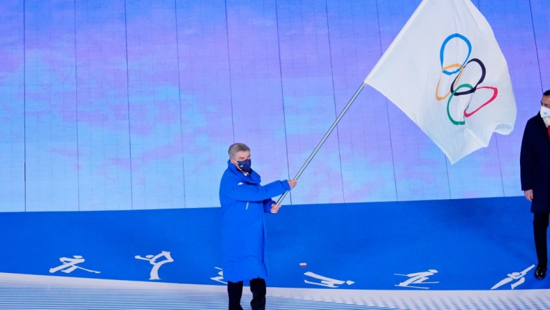 Feb 20, 2022; Beijing, CHINA; IOC president Thomas Bach waves the Olympic flag during the closing ceremony for the Beijing 2022 Olympic Winter Games at Beijing National Stadium. Mandatory Credit: George Walker IV-USA TODAY Sports