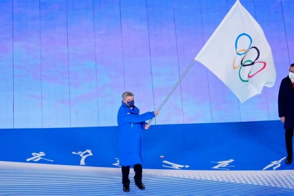 Feb 20, 2022; Beijing, CHINA; IOC president Thomas Bach waves the Olympic flag during the closing ceremony for the Beijing 2022 Olympic Winter Games at Beijing National Stadium. Mandatory Credit: George Walker IV-USA TODAY Sports