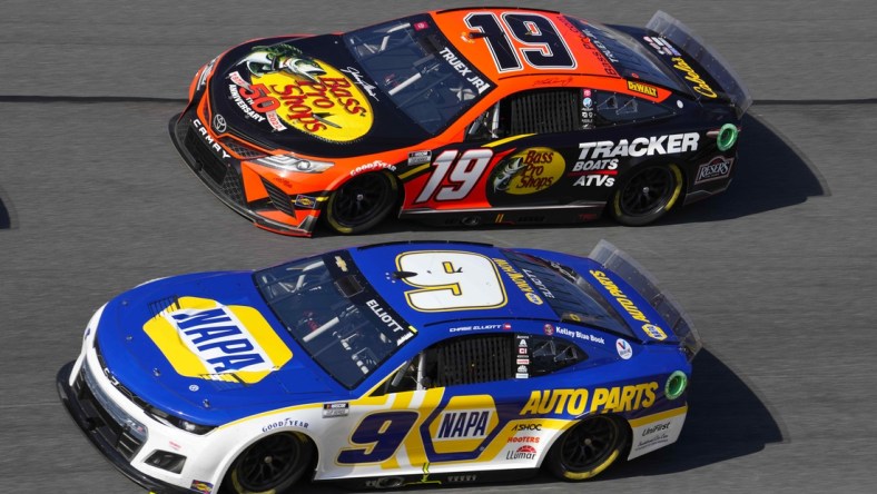 Feb 20, 2022; Daytona Beach, Florida, USA; NASCAR Cup Series driver Martin Truex Jr. (19) and driver Chase Elliott (9) race side by side during the Daytona 500 at Daytona International Speedway. Mandatory Credit: Mike Dinovo-USA TODAY Sports