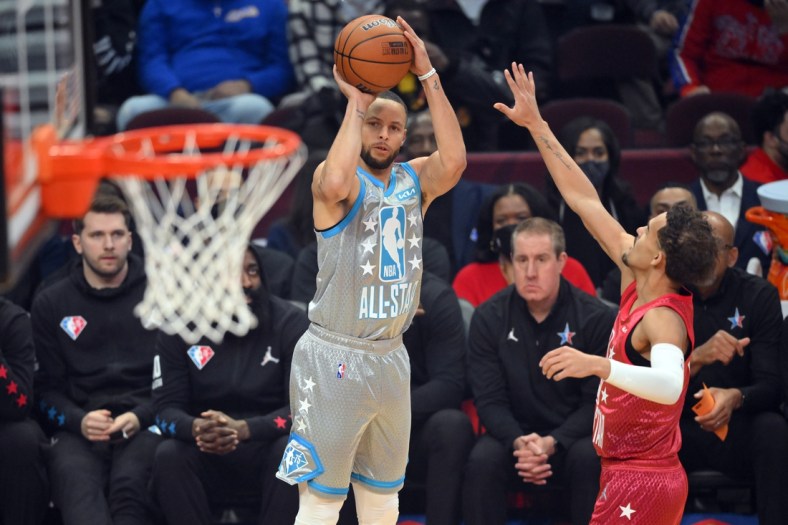 Feb 20, 2022; Cleveland, Ohio, USA; Team LeBron guard Stephen Curry (30) shoots a three point basket against Team Durant guard Trae Young (11) in the first quarter during the 2022 NBA All-Star Game at Rocket Mortgage FieldHouse. Mandatory Credit: David Richard-USA TODAY Sports