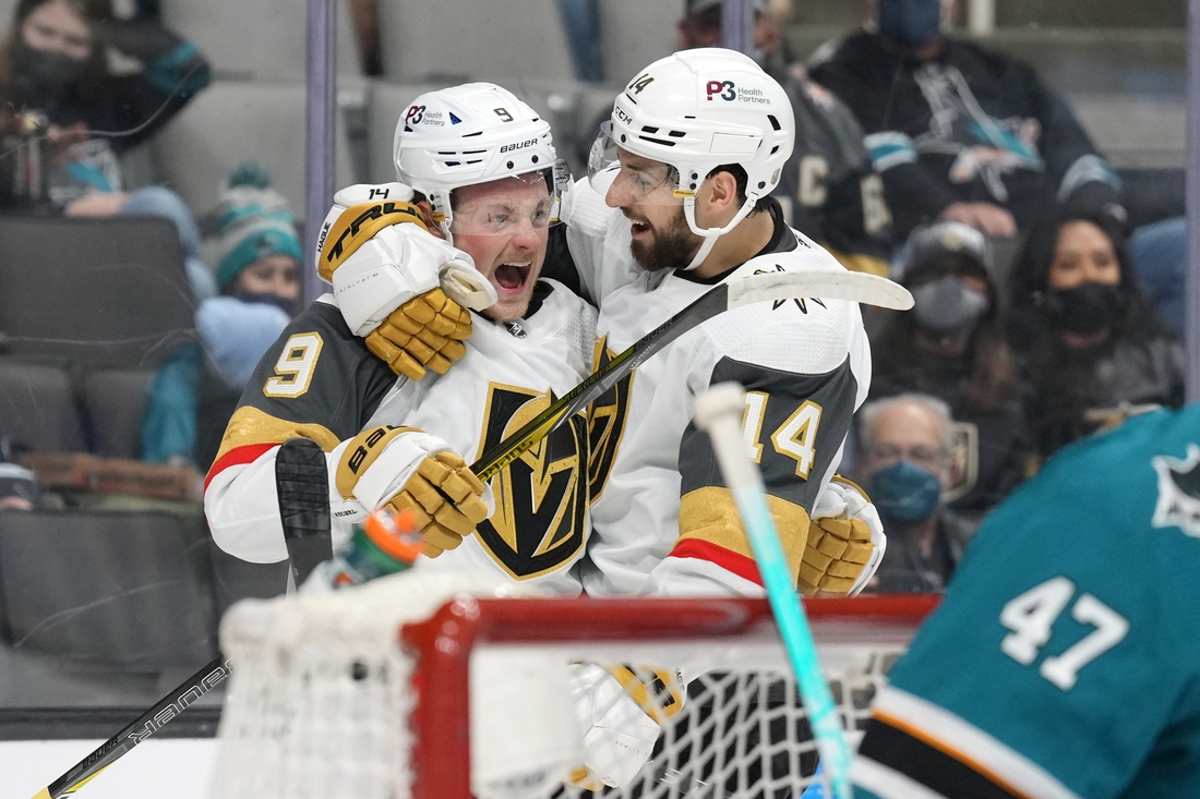 Feb 20, 2022; San Jose, California, USA; Vegas Golden Knights center Jack Eichel (9) celebrates with defenseman Nicolas Hague (14) after scoring a goal during the first period against the San Jose Sharks at SAP Center at San Jose. Mandatory Credit: Darren Yamashita-USA TODAY Sports