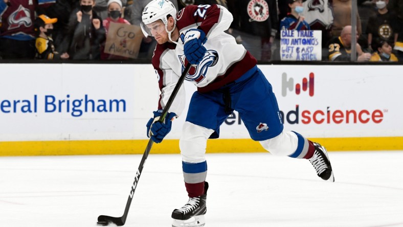 Feb 21, 2022; Boston, Massachusetts, USA; Colorado Avalanche center Nathan MacKinnon (29) takes a shot on net during warmups before a game against the Boston Bruins during the fist half at the TD Garden. Mandatory Credit: Brian Fluharty-USA TODAY Sports