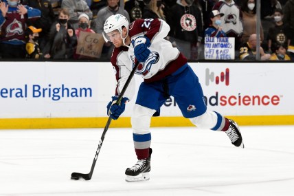 Feb 21, 2022; Boston, Massachusetts, USA; Colorado Avalanche center Nathan MacKinnon (29) takes a shot on net during warmups before a game against the Boston Bruins during the fist half at the TD Garden. Mandatory Credit: Brian Fluharty-USA TODAY Sports