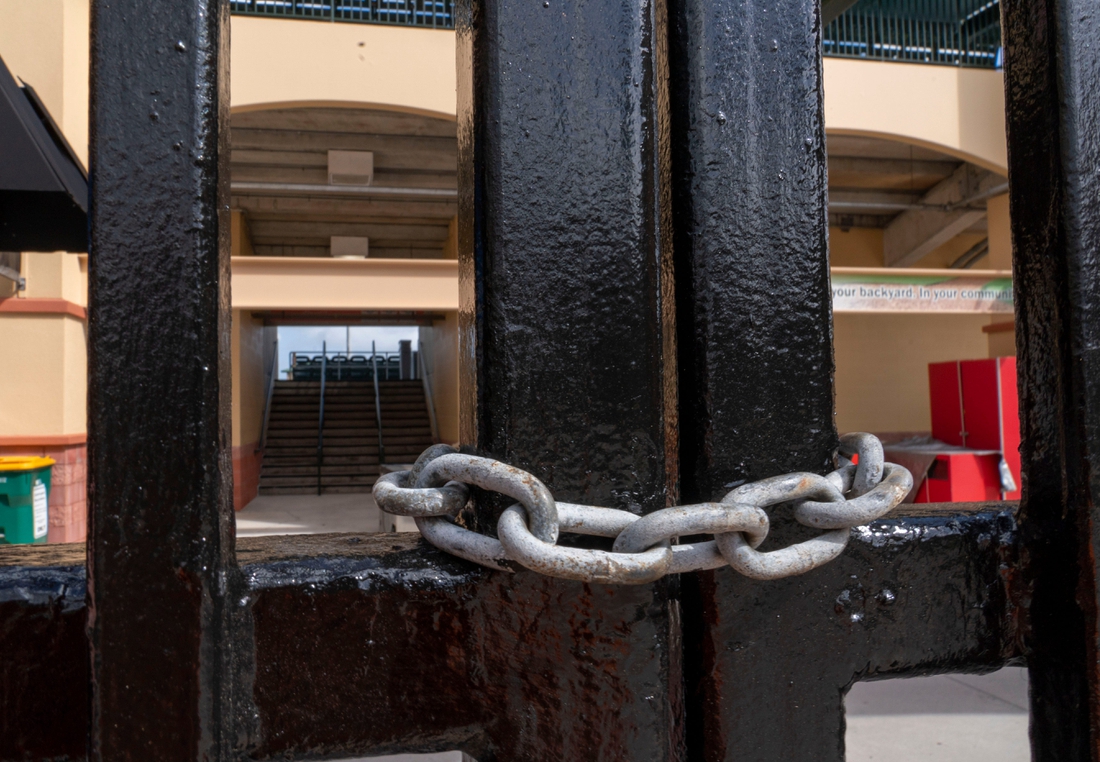 The gates are locked during the MLB lockout delaying spring training at Roger Dean Stadium in Jupiter, Florida on February 22, 2022.