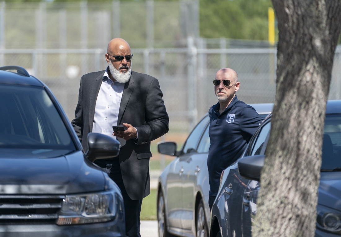 Feb 23, 2022; Jupiter, FL, USA;  Major League Baseball Players Association executive director Tony Clark, left, and chief negotiator Bruce Meyer, arrive for contract negotiations at Roger Dean Stadium in Jupiter, Florida on February 23, 2022.  Mandatory Credit: Greg Lovett-USA TODAY NETWORK