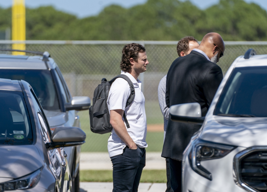 Feb 23, 2022; Jupiter, FL, USA;  New York Yankees pitcher Gerrit Cole, center, arrives for MLB contract negotiations at Roger Dean Stadium in Jupiter, Florida on February 23, 2022.   Mandatory Credit: Greg Lovett-USA TODAY NETWORK