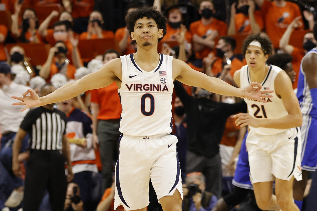 Feb 23, 2022; Charlottesville, Virginia, USA; Virginia Cavaliers guard Kihei Clark (0) reacts after making a three point field goal against the Duke Blue Devils in the first half at John Paul Jones Arena. Mandatory Credit: Geoff Burke-USA TODAY Sports