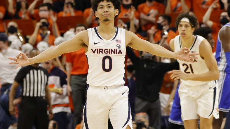 Feb 23, 2022; Charlottesville, Virginia, USA; Virginia Cavaliers guard Kihei Clark (0) reacts after making a three point field goal against the Duke Blue Devils in the first half at John Paul Jones Arena. Mandatory Credit: Geoff Burke-USA TODAY Sports