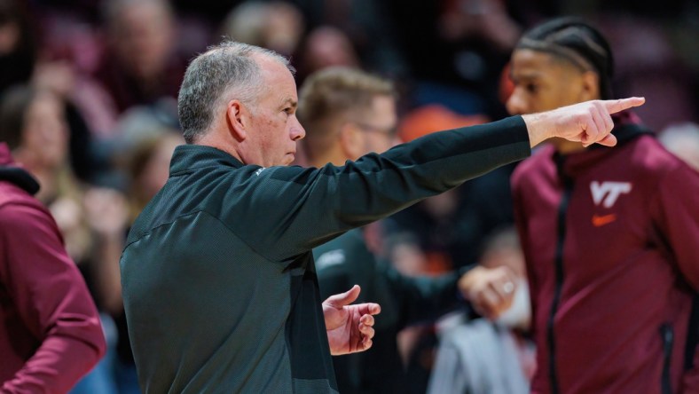 Feb 19, 2022; Blacksburg, Virginia, USA; Virginia Tech Hokies head coach Mike Young points prior to a game against the North Carolina Tar Heels at Cassell Coliseum. Mandatory Credit: Ryan Hunt-USA TODAY Sports