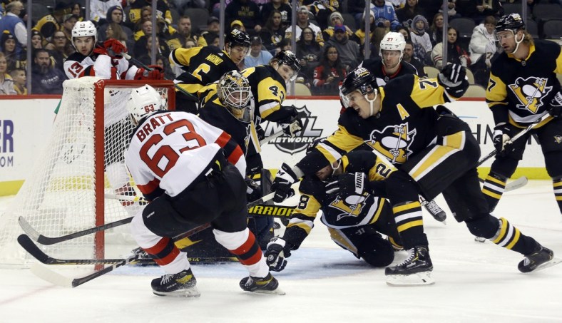 Feb 24, 2022; Pittsburgh, Pennsylvania, USA;  New Jersey Devils left wing Jesper Bratt (63) scores a goal against the Pittsburgh Penguins during the first period at PPG Paints Arena. Mandatory Credit: Charles LeClaire-USA TODAY Sports