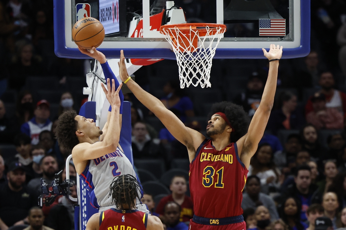 Feb 24, 2022; Detroit, Michigan, USA;  Detroit Pistons guard Cade Cunningham (2) shoots over Cleveland Cavaliers center Jarrett Allen (31) in the first half at Little Caesars Arena. Mandatory Credit: Rick Osentoski-USA TODAY Sports