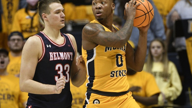 Feb 24, 2022; Murray, Kentucky, USA;  Murray State Racers forward KJ Williams (0) backs down Belmont Bruins center Nick Muszynski (33) during first half at CFSB Center. Mandatory Credit: Steve Roberts-USA TODAY Sports