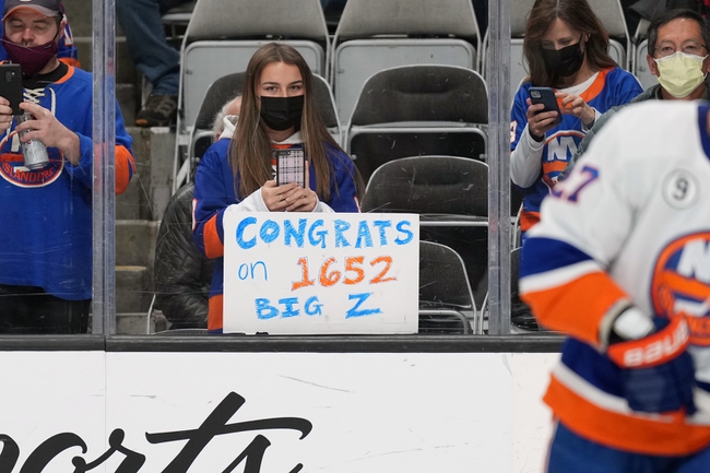 Feb 24, 2022; San Jose, California, USA; A fan displays a sign to honor New York Islanders defenseman Zdeno Chara (33) before the game against the San Jose Sharks at SAP Center at San Jose. Mandatory Credit: Darren Yamashita-USA TODAY Sports