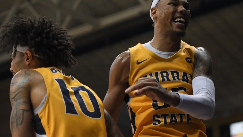 Feb 24, 2022; Murray, Kentucky, USA;  Murray State Racers guard Tevin Brown (10) and forward DJ Burns (55) celebrate a 3 pt shot from guard Rod Thomas (25) against the Belmont Bruins during second half at CFSB Center. Mandatory Credit: Steve Roberts-USA TODAY Sports