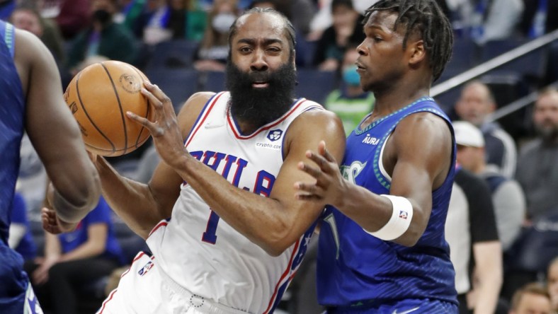 Feb 25, 2022; Minneapolis, Minnesota, USA; Philadelphia 76ers guard James Harden (1) dribbles around Minnesota Timberwolves forward Anthony Edwards (1) in the first quarter at Target Center. Mandatory Credit: Bruce Kluckhohn-USA TODAY Sports