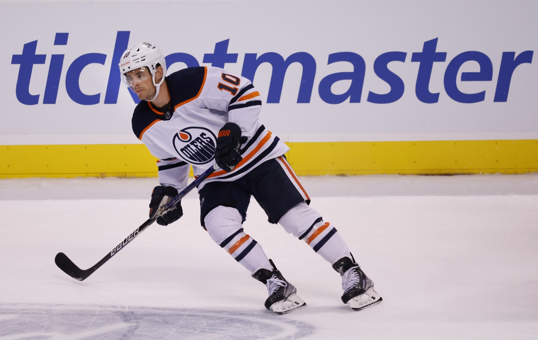 Feb 26, 2022; Sunrise, Florida, USA;  Edmonton Oilers center Derek Ryan (10) looks for a pass during the second period against the Florida Panthers at FLA Live Arena. Mandatory Credit: Reinhold Matay-USA TODAY Sports