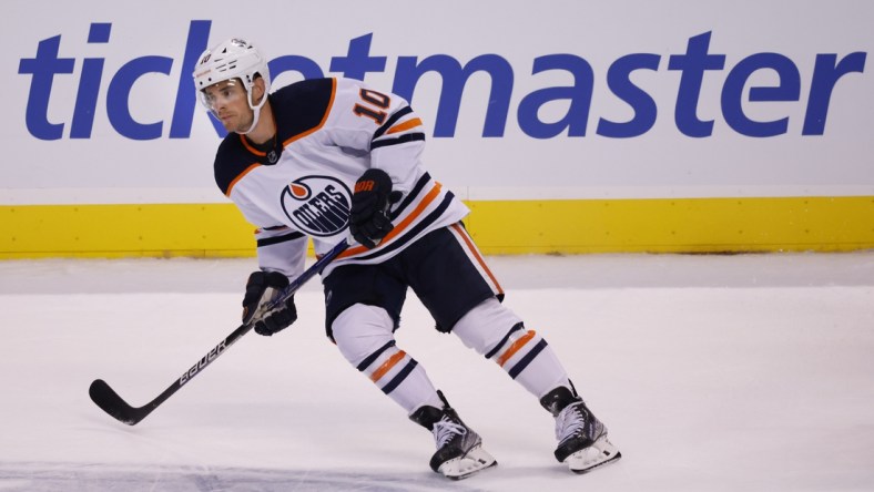 Feb 26, 2022; Sunrise, Florida, USA;  Edmonton Oilers center Derek Ryan (10) looks for a pass during the second period against the Florida Panthers at FLA Live Arena. Mandatory Credit: Reinhold Matay-USA TODAY Sports