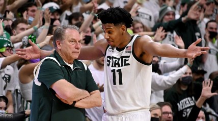 Feb 26, 2022; East Lansing, Michigan, USA;  Michigan State Spartans guard A.J. Hoggard (11) and Michigan State Spartans head coach Tom Izzo talk on the sideline in the second half at Jack Breslin Student Events Center. Mandatory Credit: Dale Young-USA TODAY Sports