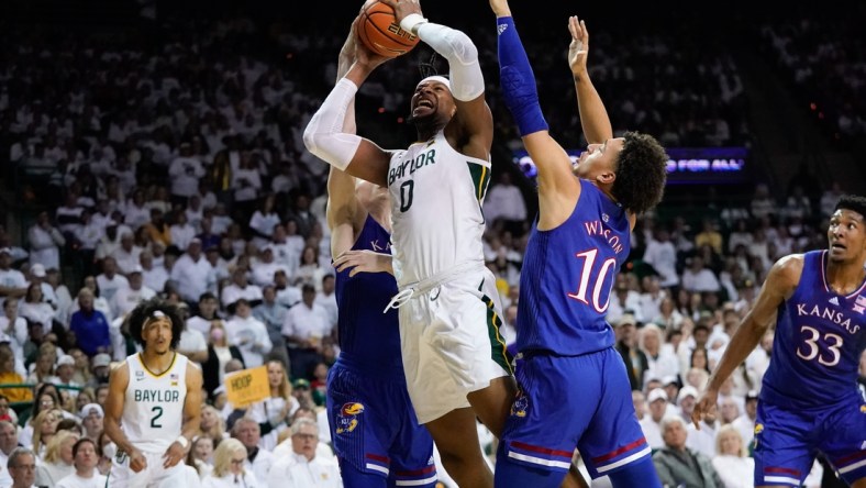 Feb 26, 2022; Waco, Texas, USA;  Baylor Bears forward Flo Thamba (0) shoots against Kansas Jayhawks forward Jalen Wilson (10) during the first half at Ferrell Center. Mandatory Credit: Chris Jones-USA TODAY Sports