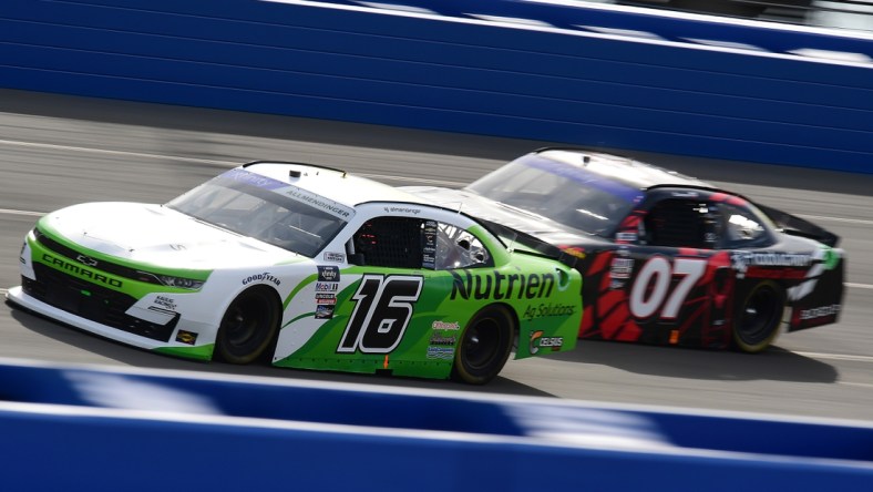 Feb 26, 2022; Fontana, California, USA; Xfinity Series driver AJ Allmendinger (16) and Xfinity Series driver Cole Custer (07) race for position during the Production Alliance Group 300 at Auto Club Speedway. Mandatory Credit: Gary A. Vasquez-USA TODAY Sports