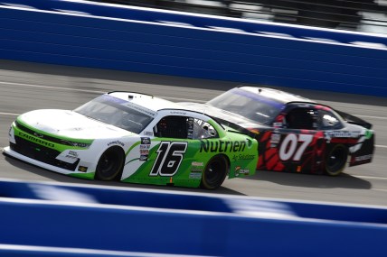 Feb 26, 2022; Fontana, California, USA; Xfinity Series driver AJ Allmendinger (16) and Xfinity Series driver Cole Custer (07) race for position during the Production Alliance Group 300 at Auto Club Speedway. Mandatory Credit: Gary A. Vasquez-USA TODAY Sports