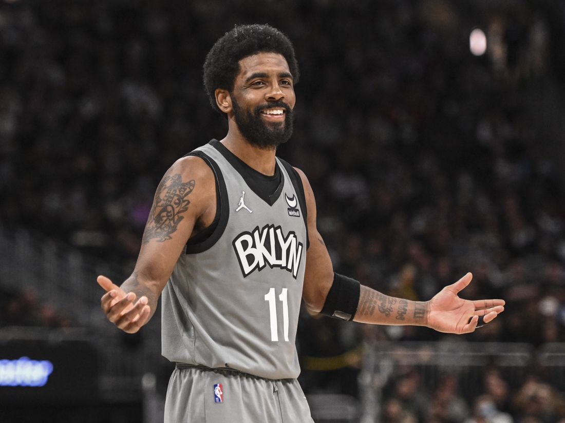 Feb 26, 2022; Milwaukee, Wisconsin, USA; Brooklyn Nets guard Kyrie Irving (11) reacts in the fourth quarter against the Milwaukee Bucks at Fiserv Forum. Mandatory Credit: Benny Sieu-USA TODAY Sports