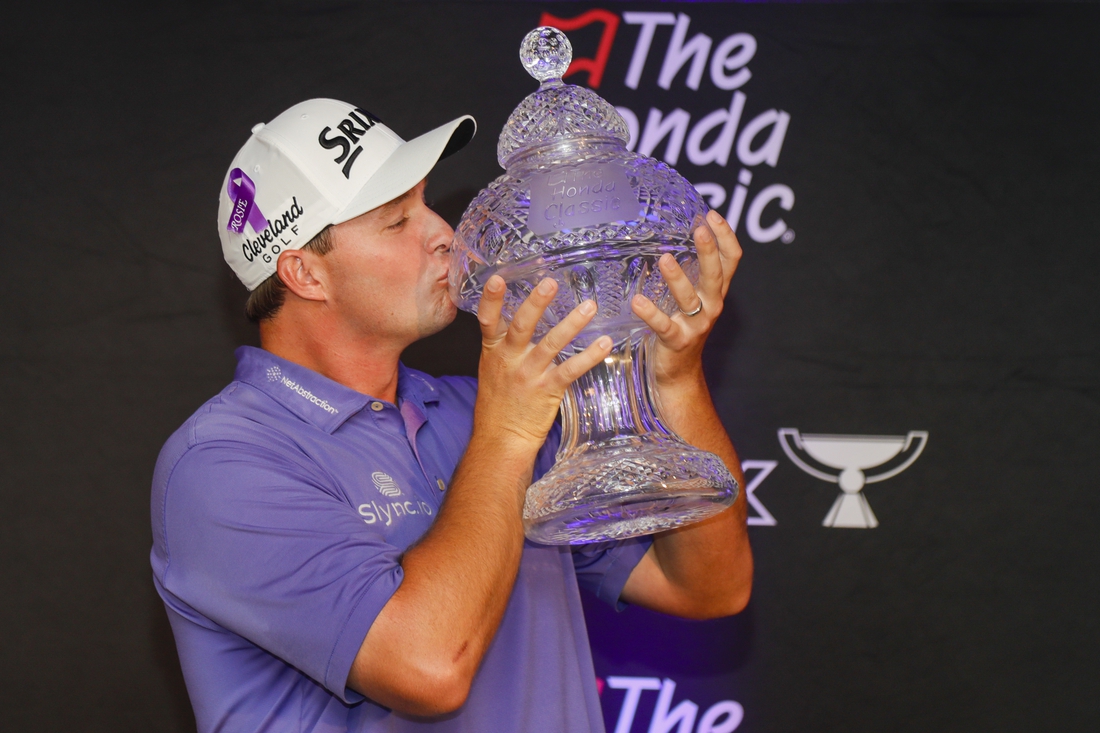 Feb 27, 2022; Palm Beach Gardens, Florida, USA; Sepp Straka kisses The Honda Classic trophy after winning The Honda Classic golf tournament. Mandatory Credit: Sam Navarro-USA TODAY Sports