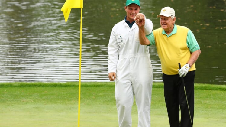 Apr 4, 2018; Augusta, GA, USA; Gary Nicklaus, Jr. the grandson of Jack Nicklaus holds up the ball after making a hole-in-one on the 9th hole during the Par 3 Contest before the Masters golf tournament at Augusta National Golf Club. Mandatory Credit: Rob Schumacher-USA TODAY Sports