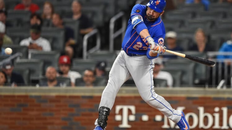 May 28, 2018; Atlanta, GA, USA; New York Mets first baseman Adrian Gonzalez (23) singles to drive in a run against the Atlanta Braves during the first inning at SunTrust Park. Mandatory Credit: Dale Zanine-USA TODAY Sports