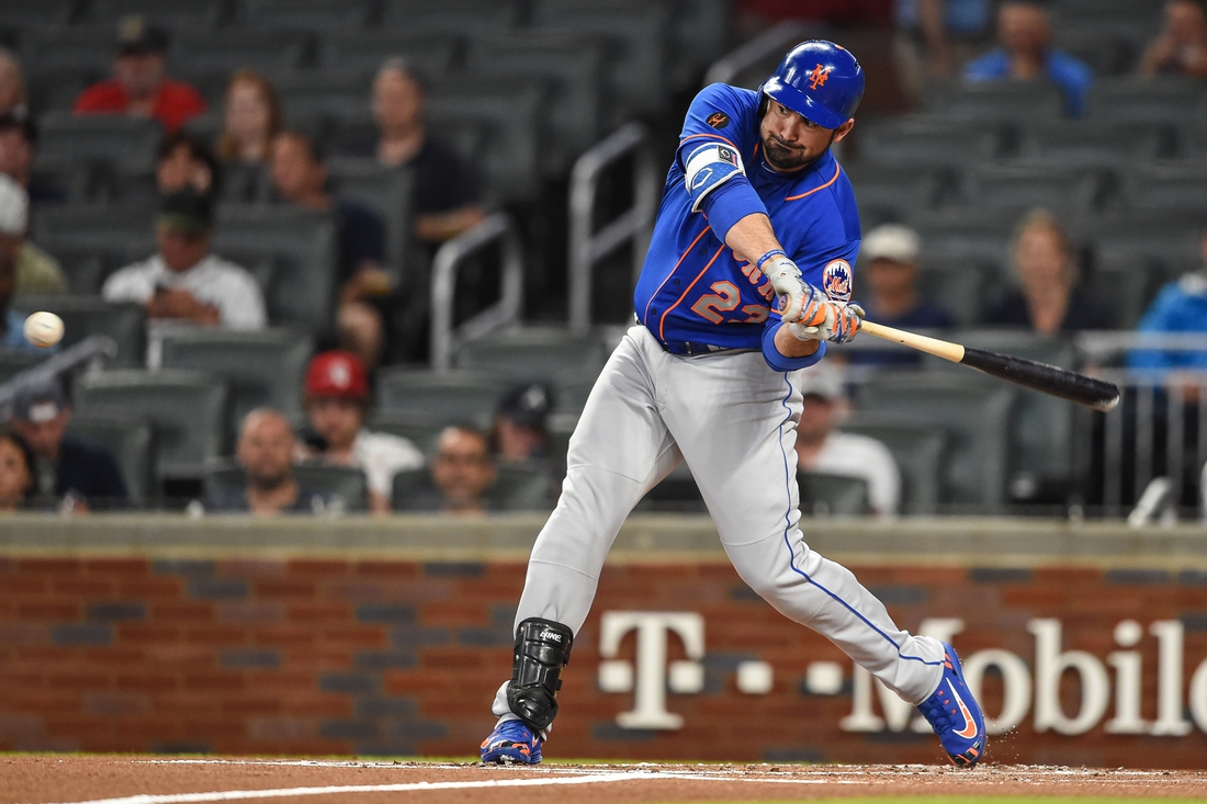 May 28, 2018; Atlanta, GA, USA; New York Mets first baseman Adrian Gonzalez (23) singles to drive in a run against the Atlanta Braves during the first inning at SunTrust Park. Mandatory Credit: Dale Zanine-USA TODAY Sports