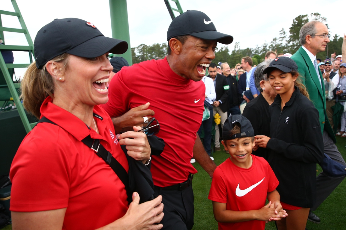 Apr 14, 2019; Augusta, GA, USA; Tiger Woods celebrates with daughter Sam and son Charlie after winning The Masters golf tournament at Augusta National Golf Club. Mandatory Credit: Rob Schumacher-USA TODAY Sports