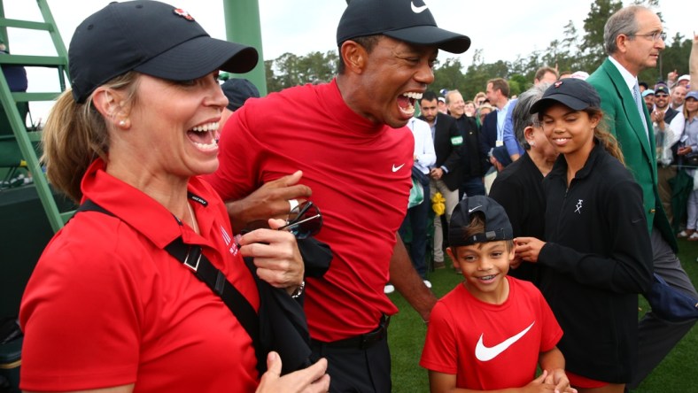 Apr 14, 2019; Augusta, GA, USA; Tiger Woods celebrates with daughter Sam and son Charlie after winning The Masters golf tournament at Augusta National Golf Club. Mandatory Credit: Rob Schumacher-USA TODAY Sports