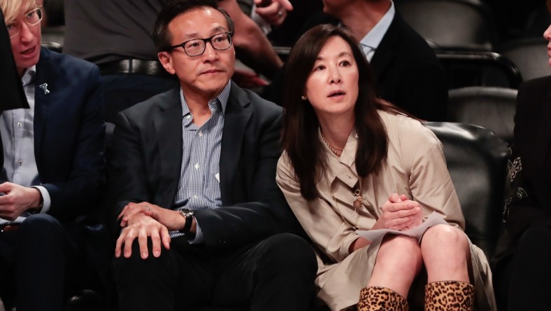 May 9, 2019; New York City, NY, USA; Taiwanese businessman Joe Tsai (left) looks on during the second half of the preseason WNBA game between the New York Liberty and the China National Team at Barclays Center.  Mandatory Credit: Vincent Carchietta-USA TODAY Sports