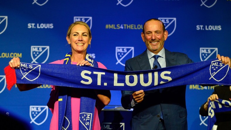 Aug 20, 2019; St. Louis, MO, USA; MLS commissioner Don Garber places poses for a photo with ownership group leader Carolyn Kindle Betz after announcing an expansion team for St. Louis at The Palladium. Mandatory Credit: Jeff Curry-USA TODAY Sports