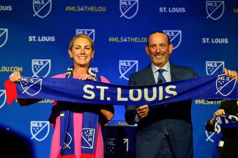 Aug 20, 2019; St. Louis, MO, USA; MLS commissioner Don Garber places poses for a photo with ownership group leader Carolyn Kindle Betz after announcing an expansion team for St. Louis at The Palladium. Mandatory Credit: Jeff Curry-USA TODAY Sports