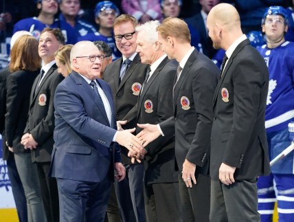 Nov 15, 2019; Toronto, Ontario, CAN; Class of 2019 Hockey Hall of Fame inductee Jim Rutherford  shakes hands with Nicklas Lindstrom prior to a game between the Boston Bruins and Toronto Maple Leafs at Scotiabank Arena. Mandatory Credit: John E. Sokolowski-USA TODAY Sports