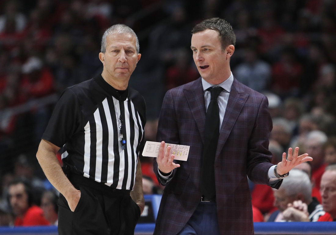 Jan 11, 2020; Dayton, Ohio, USA; Massachusetts Minutemen head coach Matt McCall talks to a referee during the first half against the Dayton Flyers at University of Dayton Arena. Mandatory Credit: David Kohl-USA TODAY Sports