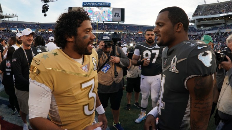 Jan 26, 2020; Orlando, Florida, USA;  NFC quarterback Russell Wilson of the Seattle Seahawks (3) and AFC quarterback Deshaun Watson of the Houston Texans (4) talk after the 2020 NFL Pro Bowl at Camping World Stadium. The AFC defeated the NFC 38-33.  Mandatory Credit: Kirby Lee-USA TODAY Sports