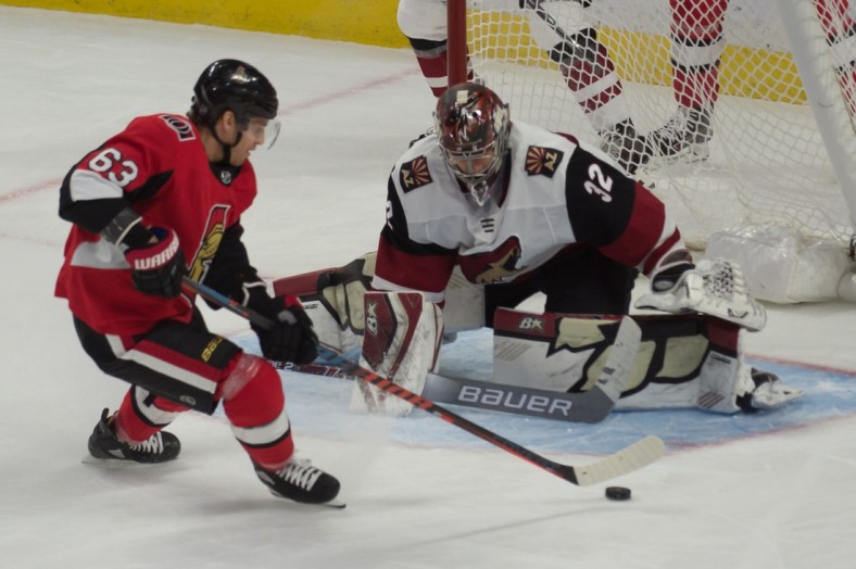 Feb 13, 2020; Ottawa, Ontario, CAN; Ottawa Senators right wing Tyler Ennis (63) shoots on Arizona Coyotes goalie Antti Raanta (32) in the third period at the Canadian Tire Centre. Mandatory Credit: Marc DesRosiers-USA TODAY Sports