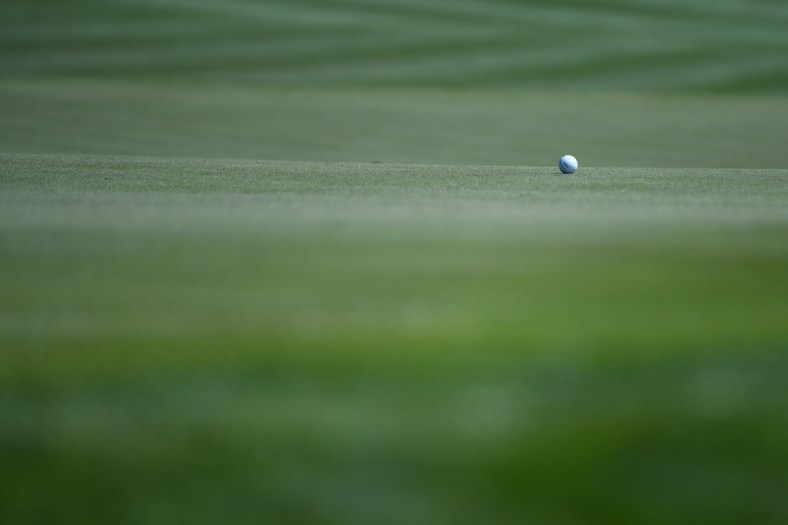Mar 12, 2020; Ponte Vedra Beach, Florida, USA; A general view of a golf ball on the 18th hole during the first round of the 2020 edition of The Players Championship golf tournament at TPC Sawgrass - Stadium Course. Mandatory Credit: Adam Hagy-USA TODAY Sports