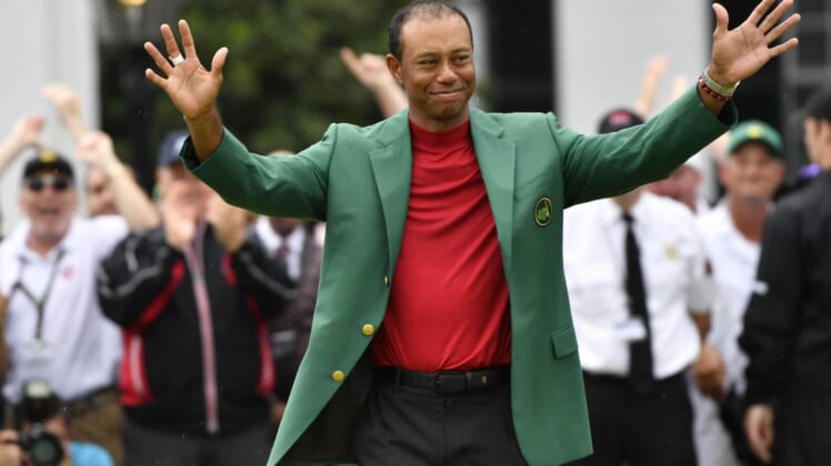 Tiger Woods celebrates with the green jacket after winning the 2019 Masters at Augusta National Golf Club.ghows_gallery_ei-LK-200408240-ef111a71.jpg