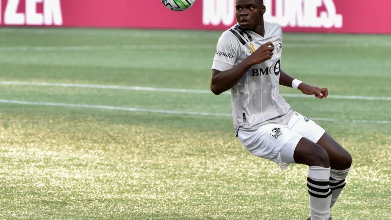 Sep 23, 2020; Foxborough, Massachusetts, USA;  Montreal Impact defender Karifa Yao (24) keeps his eyes on the ball during the first half against the New England Revolution at Gillette Stadium. Mandatory Credit: Bob DeChiara-USA TODAY Sports