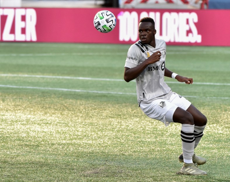 Sep 23, 2020; Foxborough, Massachusetts, USA;  Montreal Impact defender Karifa Yao (24) keeps his eyes on the ball during the first half against the New England Revolution at Gillette Stadium. Mandatory Credit: Bob DeChiara-USA TODAY Sports