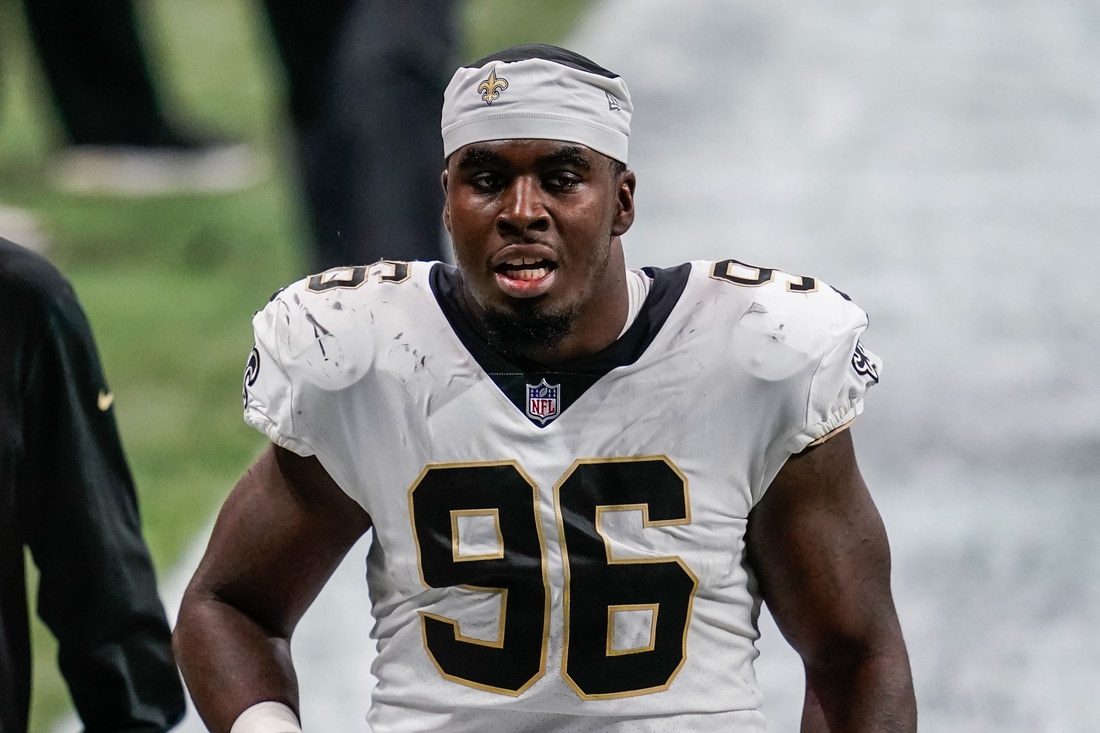 New Orleans Saints defensive end Carl Granderson signs a four-year