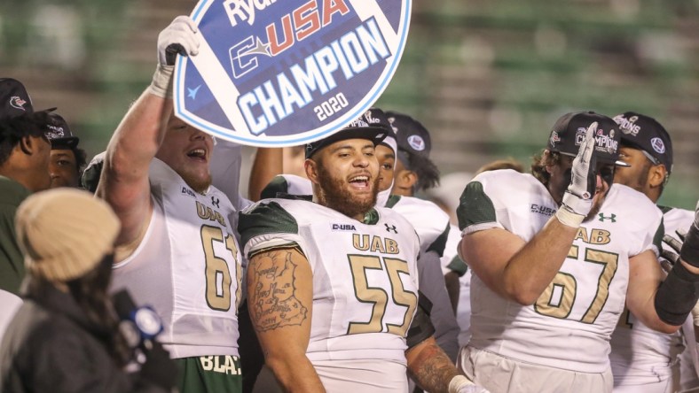 Dec 18, 2020; Huntington, West Virginia, USA; UAB Blazers players celebrate after defeating the Marshall Thundering Herd for the Conference USA Championship at Joan C. Edwards Stadium. Mandatory Credit: Ben Queen-USA TODAY Sports