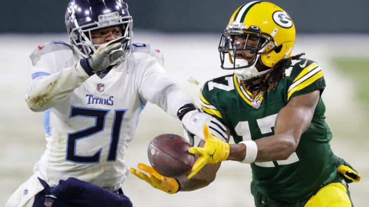 Green Bay Packers wide receiver Davante Adams pulls down a long reception against Tennessee Titans cornerback Malcolm Butler late in the fourth quarter during their football game Sunday, Dec. 27, 2020, at Lambeau Field in Green Bay, Wis.Apc Packvstitans 1227200917