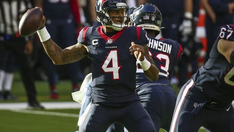 Jan 3, 2021; Houston, Texas, USA; Houston Texans quarterback Deshaun Watson (4) throws a pass against the Tennessee Titans during the first quarter at NRG Stadium. Mandatory Credit: Troy Taormina-USA TODAY Sports